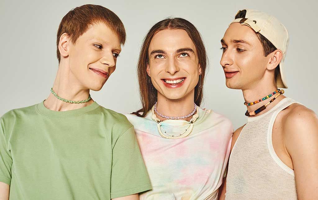 Three people from the LGBTQIA+ community are happy expressing their authentic selves through fashion.