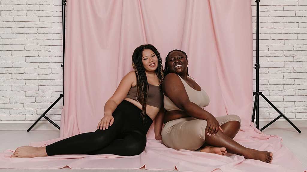 Two african-american women sitting on a pink backdrop in a photo studio.  Knowing how to start a fashion brand requires building an audience of potential customers. A fashion startup may use social media to increase visibility at a relatively low cost as part of their fashion marketing toolkit. Having a great idea for a new product is just the first step in your fashion entrepreneurship journey. You&rsquo;ll still need to build a fashion brand tech pack and know how to find a fashion manufacturer partner that meets your MOQ minimum order quantity.