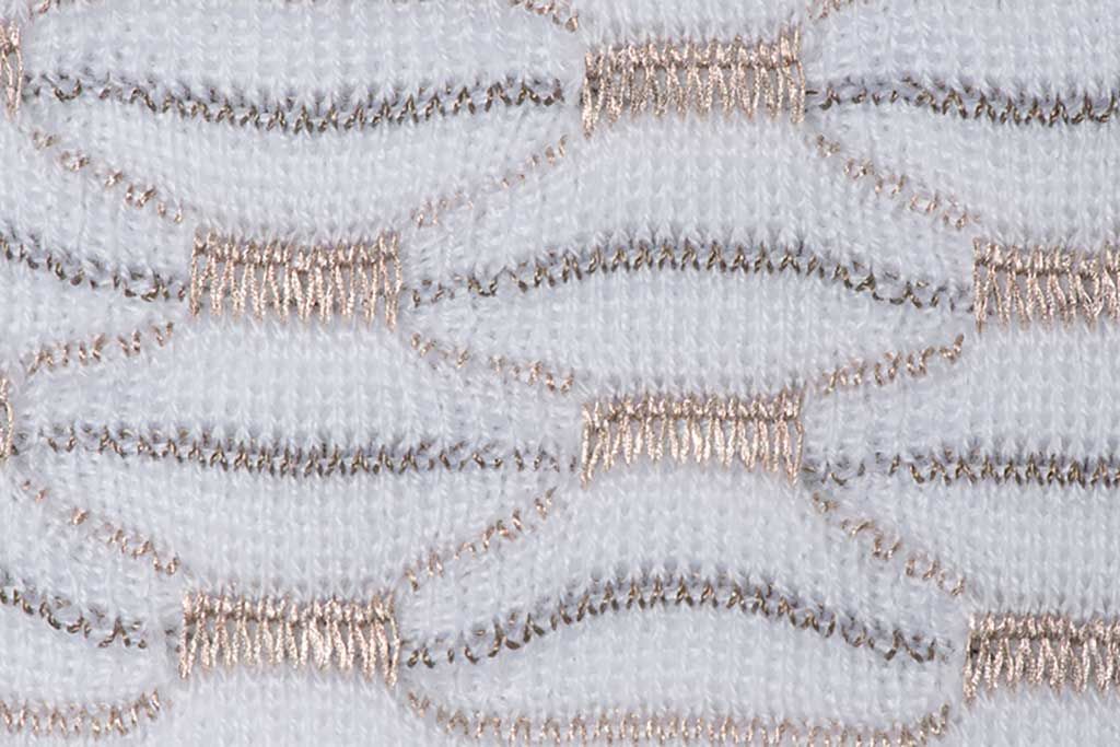 A knit pressure sensor matrix acts as a switch or sensor, depending on the distribution of conductive threads in the pattern. Three-dimensional structures on the surface of the knit can be made using hang-up stitches. These are stitches that remain on the needles while only the surrounding stitches are knit. Using two needle beds, this technique produces a relief-like structure, where parts of the knit are slightly elevated from the surface. This knit technology is part of the smart textile innovation in knits.