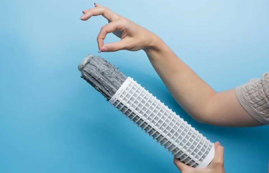 Woven nylon fibers showing fraying and breakage after nine wash cycles.